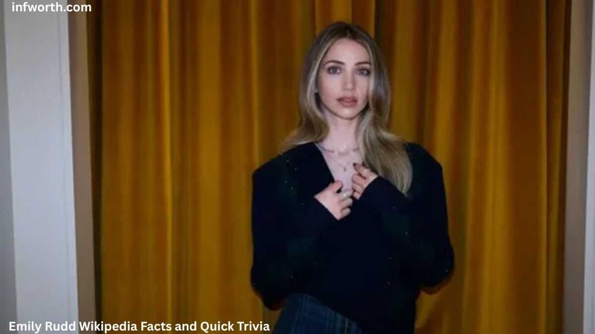 Emily Rudd posing in front of golden curtains during a photoshoot – Emily Rudd Net Worth article featured image.