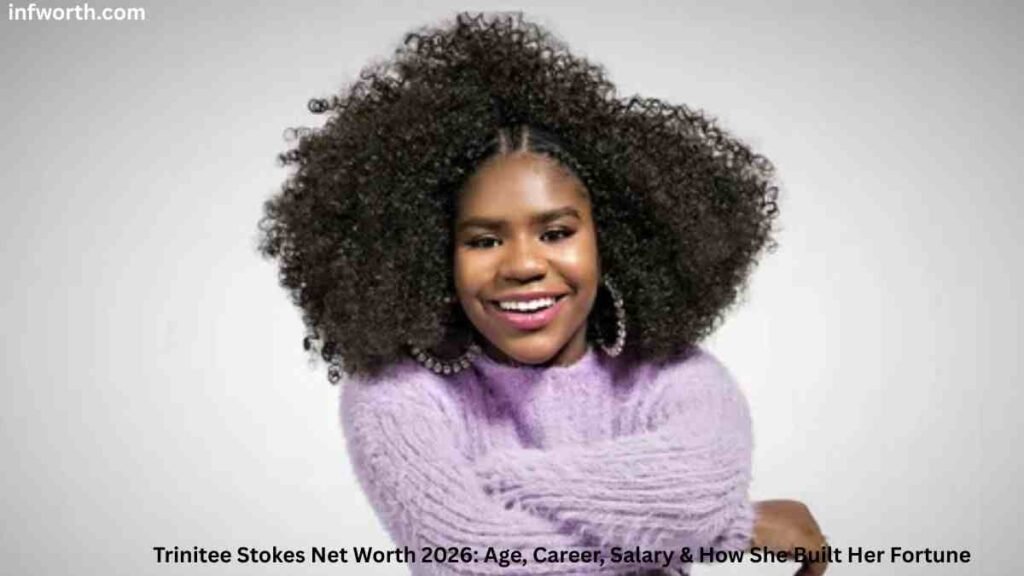 Trinitee Stokes smiling in a purple sweater – Trinitee Stokes Net Worth 2026