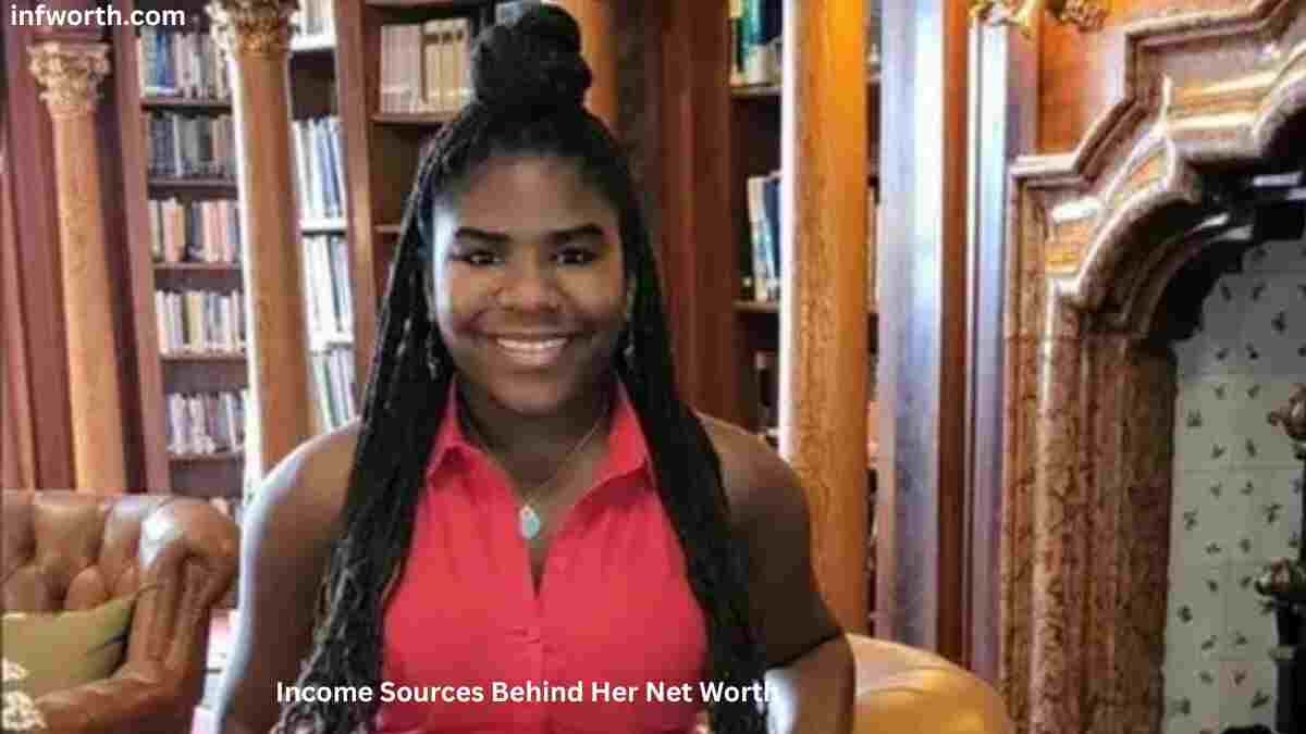 Trinitee Stokes smiling in a red sleeveless top while discussing her income sources – Trinitee Stokes Net Worth