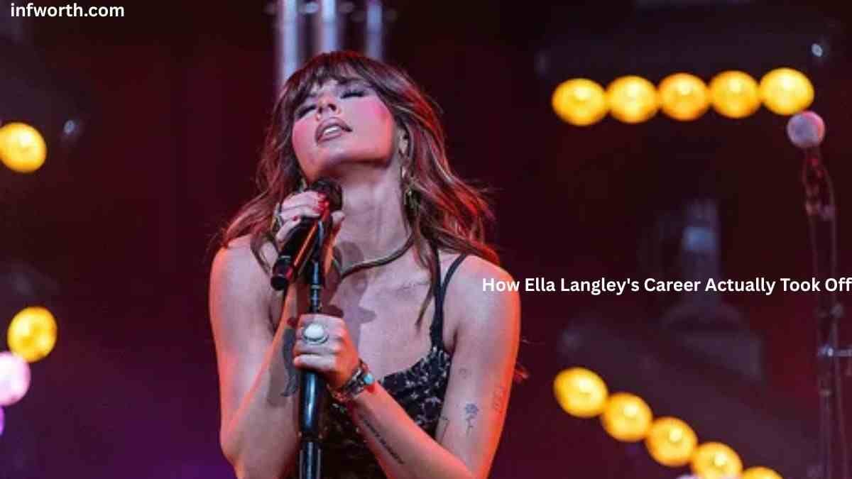 Ella Langley Net Worth – Ella Langley performing live on stage with a microphone during a country music concert.