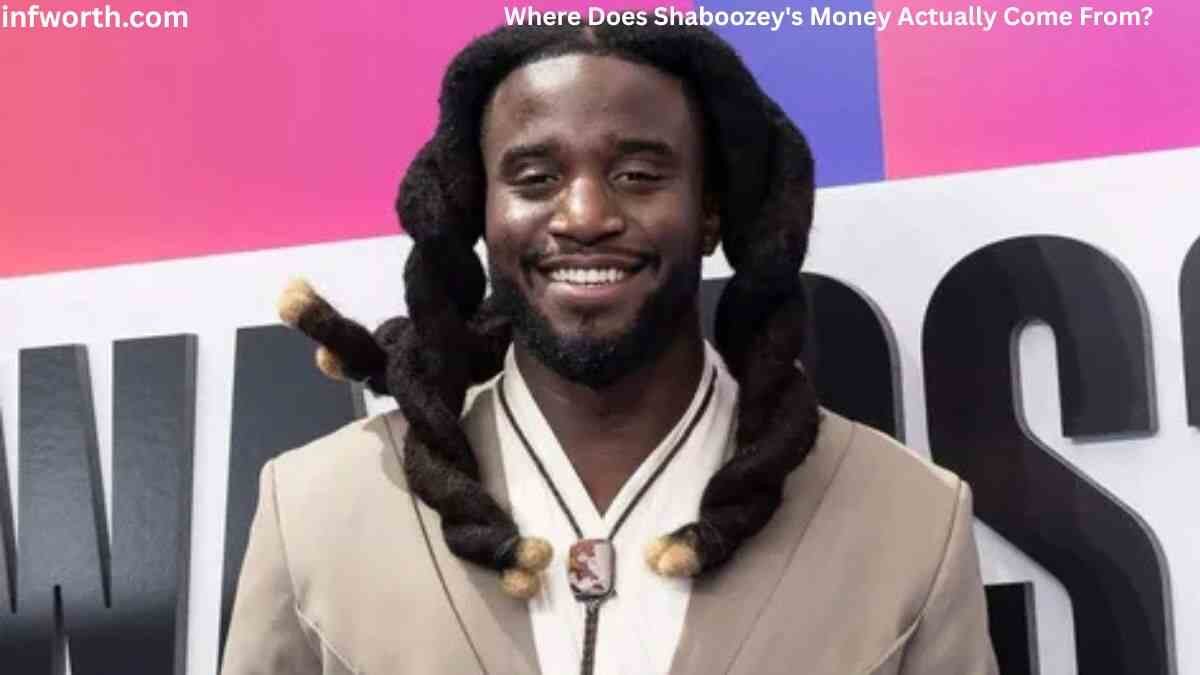 Shaboozey Net Worth – Shaboozey smiling at a public event as his music career and income continue to grow.
