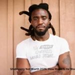 Shaboozey Net Worth – Shaboozey posing in a white T-shirt during the rise of his successful music career in 2026.