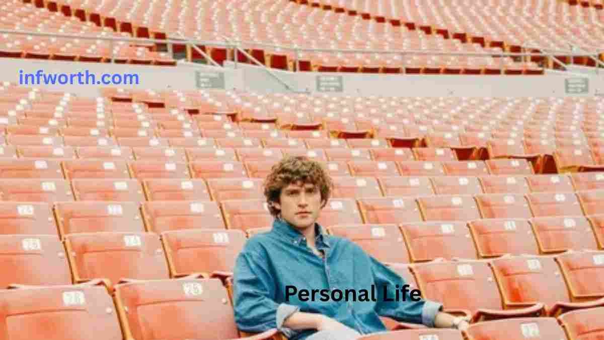 Vincent Mason sitting in a stadium during his personal life
