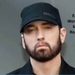 Eminem Net Worth 2026 – Rapper Eminem wearing a black cap and jacket