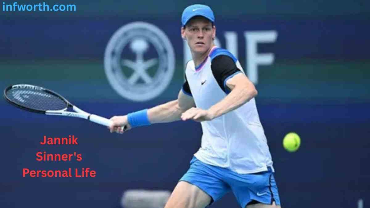 Jannik Sinner playing tennis in a blue and white outfit – Jannik Sinner Net Worth 2026